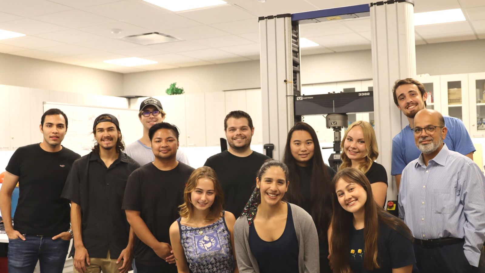 students and faculty in a lab